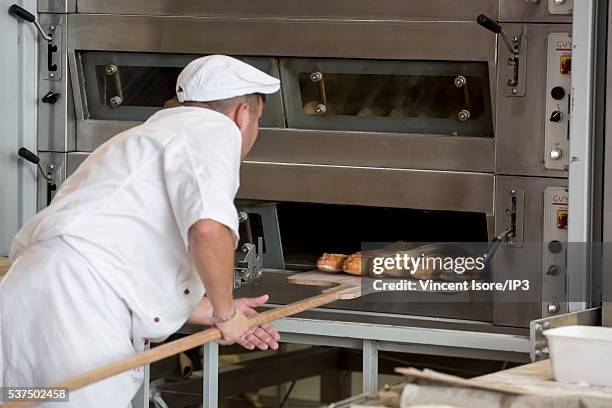 An illustrative picture showing the making of french baguettes in a bakery during the annual Bread Fair on May 21, 2016 in Paris, France.