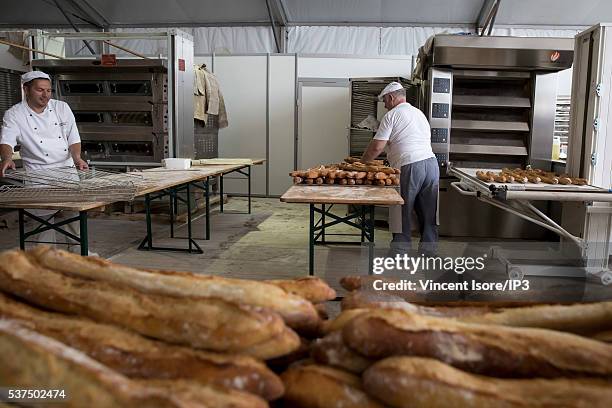 An illustrative picture showing the making of french baguettes in a bakery during the annual Bread Fair on May 21, 2016 in Paris, France.