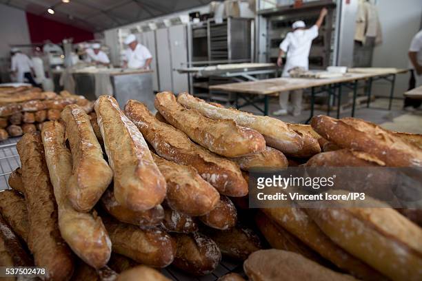 An illustrative picture showing the making of french baguettes and croissants in a bakery during the annual Bread Fair on May 21, 2016 in Paris,...