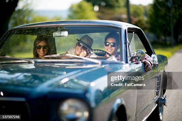 driving a classic car - 3 guy friends road trip stock pictures, royalty-free photos & images