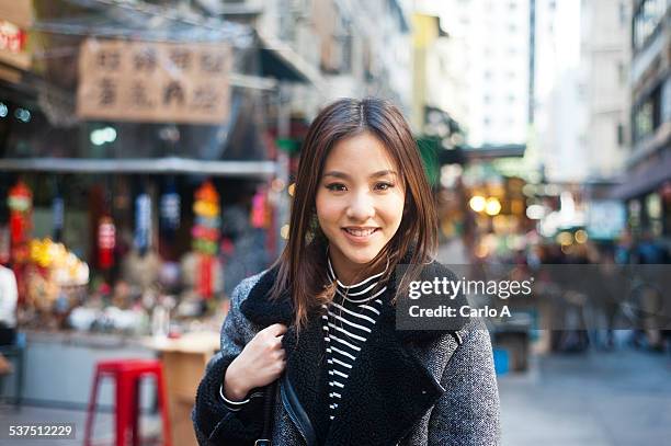 young woman in hong kong - mulher chinesa imagens e fotografias de stock