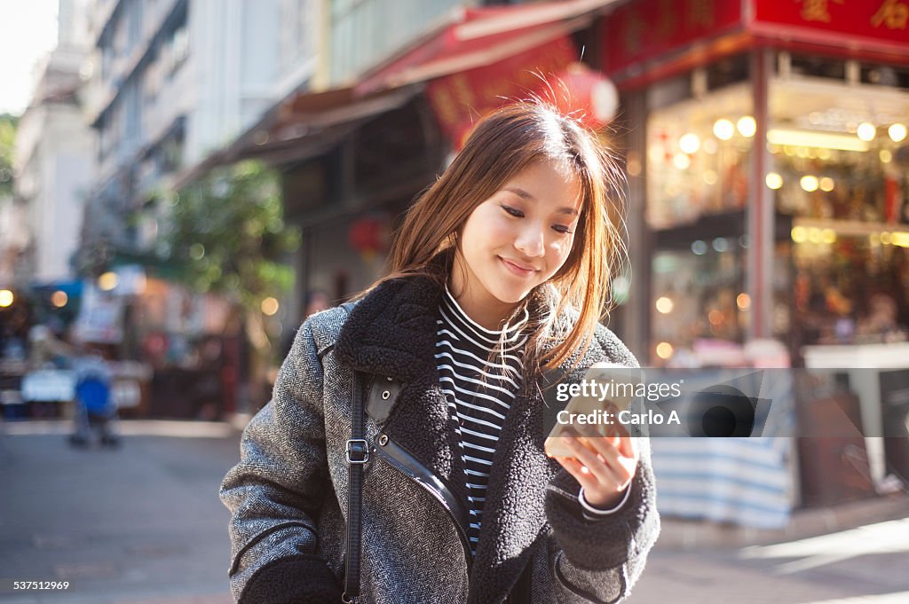 Young woman at mobile phone