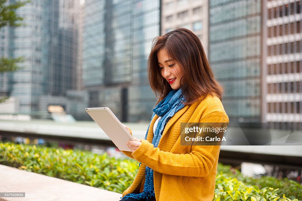 Young woman at digital tablet
