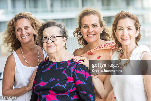 caucasian senior mother posing with her mature daughters - 1950 2016 stock pictures, royalty-free photos & images