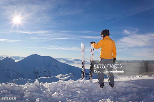 skier in snowy mountains - ski jacket stock pictures, royalty-free photos & images