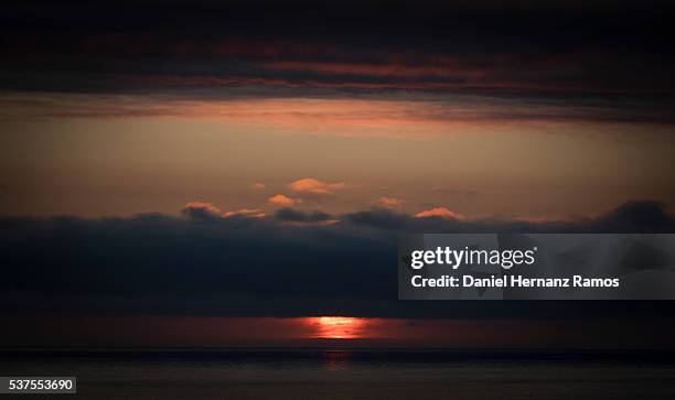 sunset in the sea. a guarda. galicia - guarda sol stock pictures, royalty-free photos & images