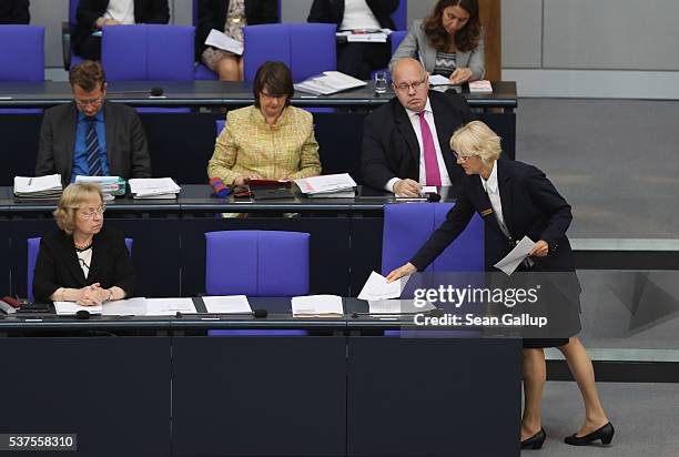 The seats of German Chancellor Angela Merkel and Vice Chancellor Sigmar Gabriel stand empty during discussions at the Bundestag on whether to...