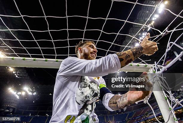 Sergio Ramos of Real madrid cuts the net after winning the Champions League final during the UEFA Champions League final match between Real Madrid...