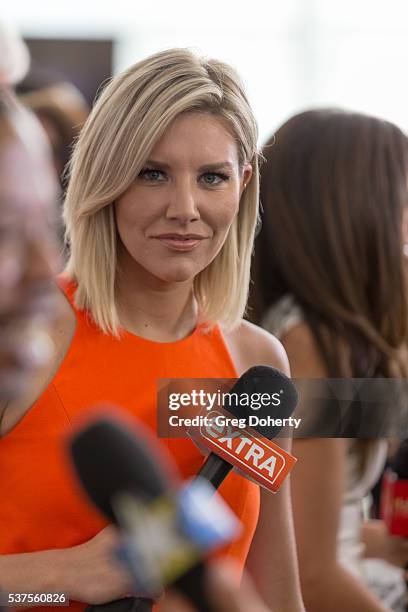 Extra co-host and sportscaster with Fox Sports One, Charissa Thompson conducting red carpet interviews at the Premiere Of ESPN Films' "O.J.: Made In...