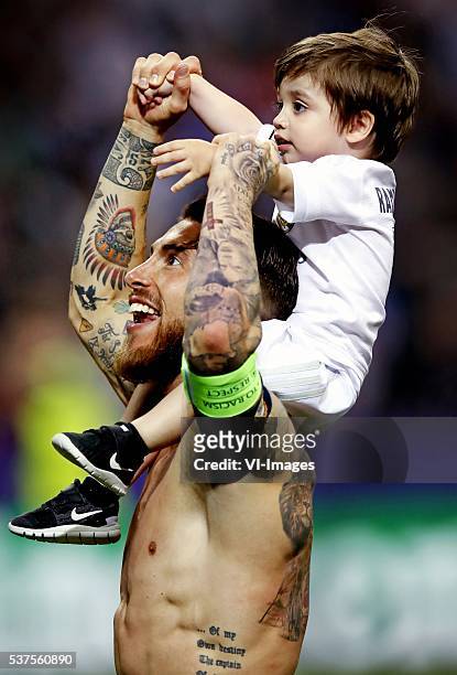 Sergio Ramos of Real Madrid holds his son after winning the Champions League final during the UEFA Champions League final match between Real Madrid...