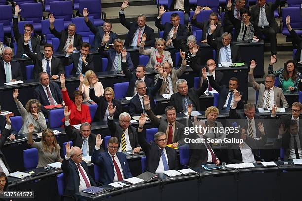 Parliamentarians approve with a show of hands a resolution to recognize the 1915 Armenian genocide on June 2, 2016 in Berlin, Germany. The Bundestag...