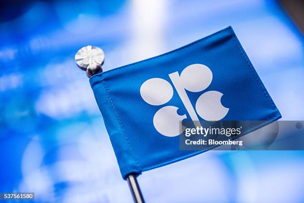 An OPEC branded flag sits on a table ahead of the 169th Organization of Petroleum Exporting Countries meeting in Vienna, Austria, on Thursday, June...