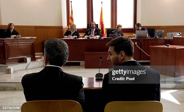 Lionel Messi of FC Barcelona and his father Jorge Horacio Messi seen inside the court during the third day of the trial on June 2, 2016 in Barcelona,...