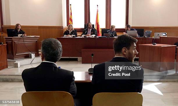 Lionel Messi of FC Barcelona and his father Jorge Horacio Messi seen inside the court during the third day of the trial on June 2, 2016 in Barcelona,...