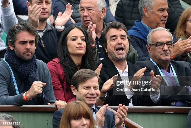 Arnaud Lagardere and his wife Jade Lagardere cheer for their friend Richard Gasquet of France against Andy Murray of Great Britain during day 11 of...