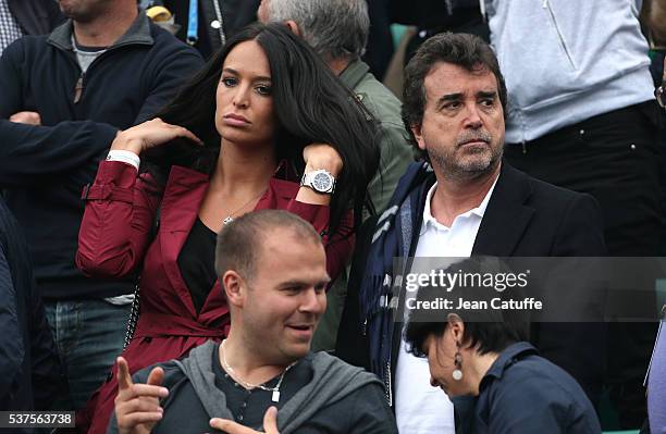 Arnaud Lagardere and his wife Jade Lagardere cheer for their friend Richard Gasquet of France against Andy Murray of Great Britain during day 11 of...
