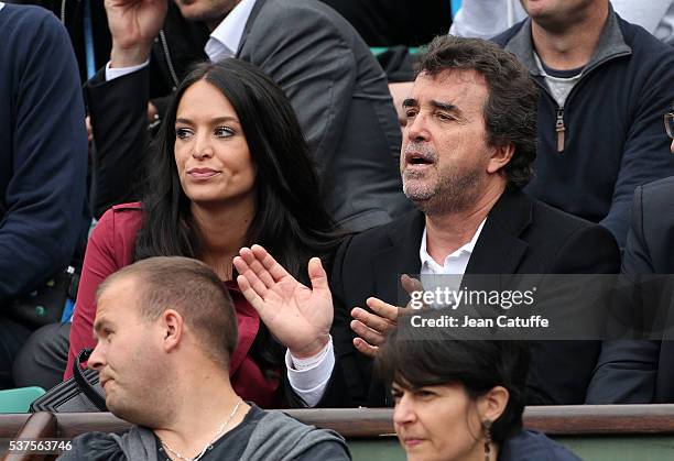 Arnaud Lagardere and his wife Jade Lagardere cheer for their friend Richard Gasquet of France against Andy Murray of Great Britain during day 11 of...