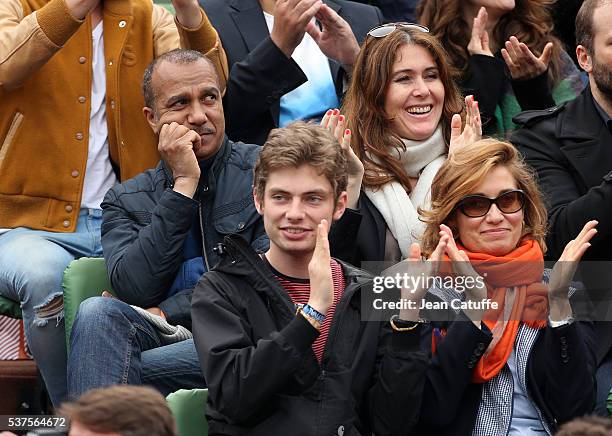 Pascal Legitimus and his wife Adriana Santini, below them Emmanuelle Devos with her son Raphael attend day 11 of the 2016 French Open held at...