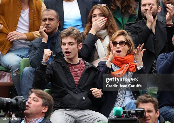 Pascal Legitimus and his wife Adriana Santini, below them Emmanuelle Devos with her son Raphael attend day 11 of the 2016 French Open held at...