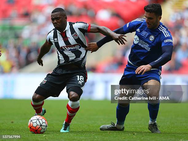 Jon-Paul Pittman of Grimsby Town and Hamza Bencherif of Halifax Town during The FA Trophy Final match between Grimsby Town and Halifax Town at...