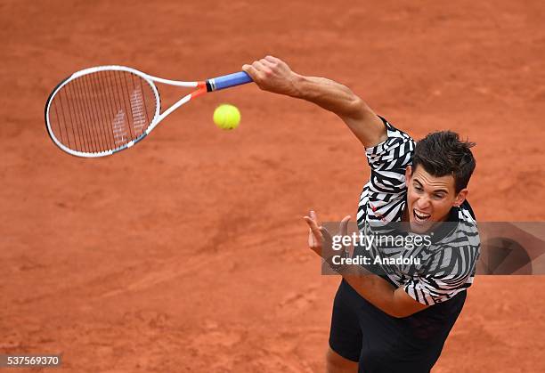 Dominic Thiem of Austria returns the ball during the match against David Goffin of Belgium in the men's single quarter final match at the French Open...