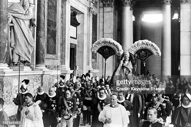 The Supreme Pontiff Pius XI wearing the tiara and moving on 'sedia Gestatoria' blesses the crowd at the Basilica of Saint Paul,in Rome, Italy, on...