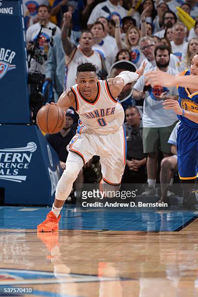 Russell Westbrook of the Oklahoma City Thunder dribbles the ball up court against the Golden State Warriors in Game Four of the Western Conference...