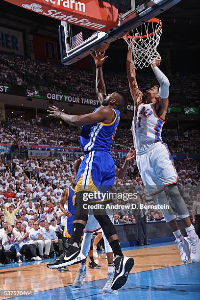 Festus Ezeli of the Golden State Warriors drives to the basket against the Oklahoma City Thunder in Game Four of the Western Conference Finals during...