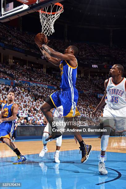 Harrison Barnes of the Golden State Warriors drives to the basket against the Oklahoma City Thunder in Game Four of the Western Conference Finals...