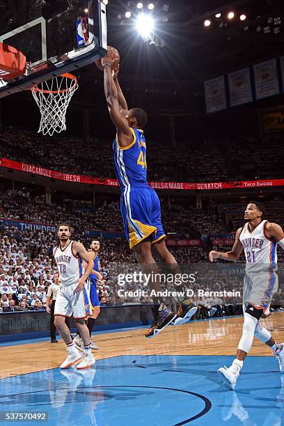 Harrison Barnes of the Golden State Warriors dunks the ball against the Oklahoma City Thunder in Game Four of the Western Conference Finals during...