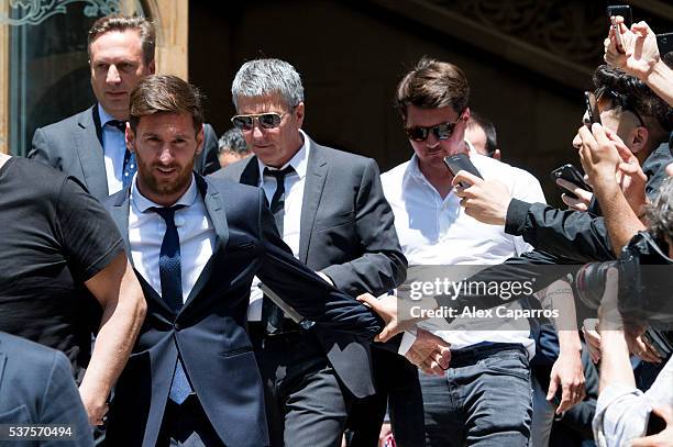 Lionel Messi leaves the courthouse followed by his father Jorge Horacio Messi and his brother Rodrigo Messi on June 2, 2016 in Barcelona, Spain....