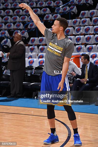 Stephen Curry of the Golden State Warriors warms up before Game Four of the Western Conference Finals against the Oklahoma City Thunder during the...