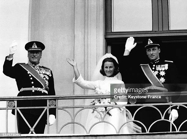 After the ceremony, the royal couple and King Olav V salute the crowd from the balcony of the Royal Palace, on August 30, 1968 in Oslo, Norway.