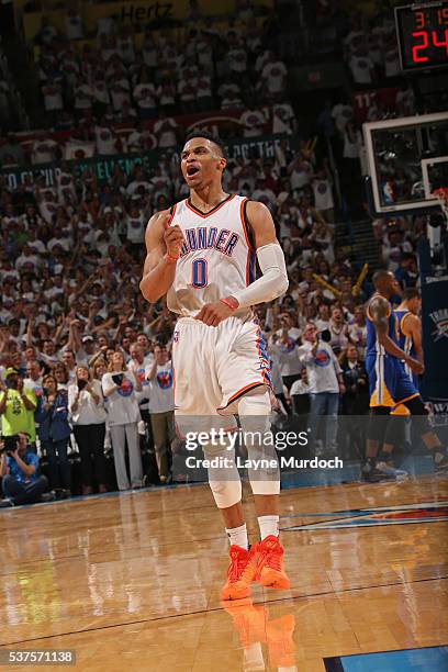 Russell Westbrook of the Oklahoma City Thunder celebrates a shot as he runs up court against the Golden State Warriors in Game Four of the Western...