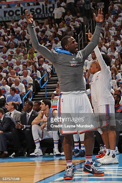 Dion Waiters of the Oklahoma City Thunder celebrates a three point basket from the bench against the Golden State Warriors in Game Four of the...