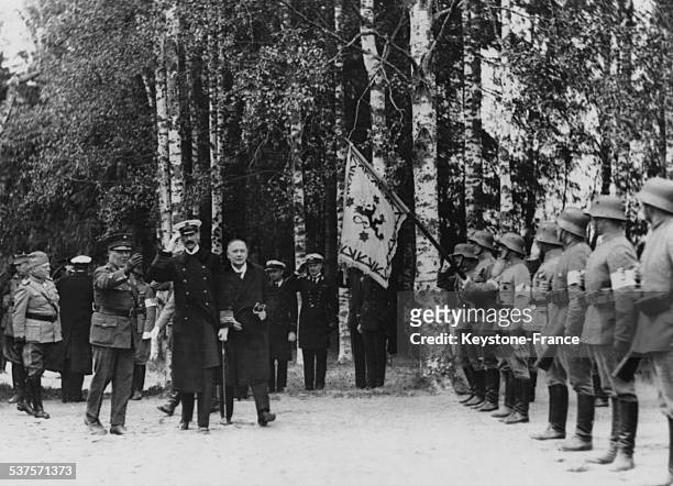 The Finnish General Malmberg, King Haakon VII of Norway and the President of Finland Relander are reviewing the cadets of school officers, circa 1920...