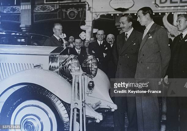 Alphonse XIII, former king of Spain, and Prince George, Duke of Kent, visit the auto show at the Olympia in London, United Kingdom, on October 13,...