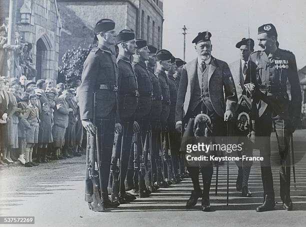 The King George V and Prince George, Duke of Kent, review the Scottish guard in Ballater before going to Balmoral Castle in Scotland, United Kingdom,...