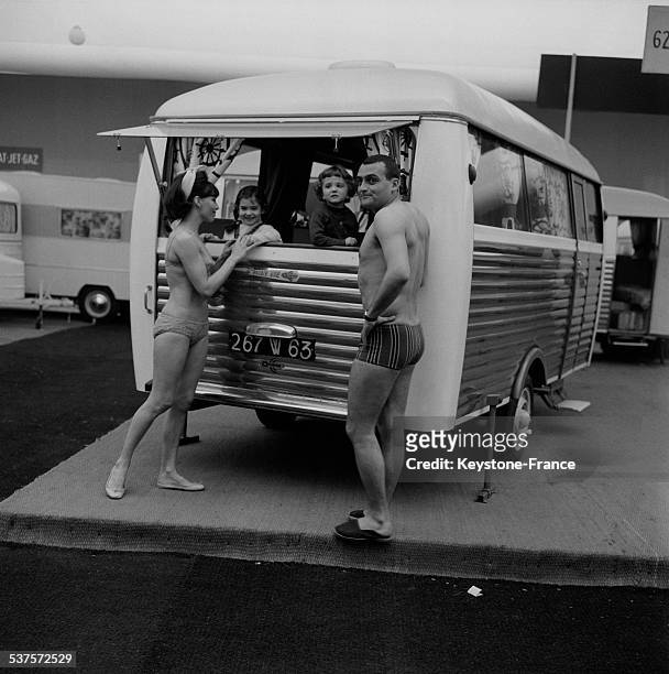 Family presents a model of camping- because during the Camping, caravaning and sports' fair at the Exhibition Palace at the Porte de Versailles on...