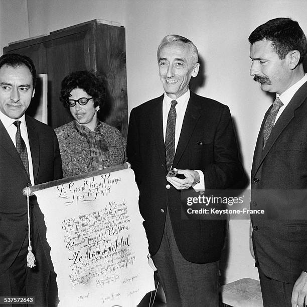 Major Jacques-Yves Cousteau receives the 'Grand Prize Of Cinema for Youth' for his film 'The World Without Sun' at the National Pedagogical Institute...