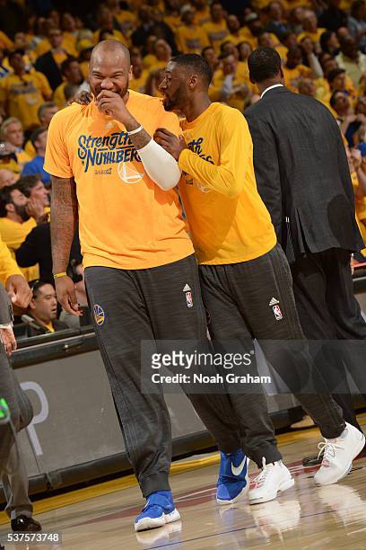 Marreese Speights and Ian Clark of the Golden State Warriors laugh and talk in Game Five of the Western Conference Finals against the Oklahoma City...