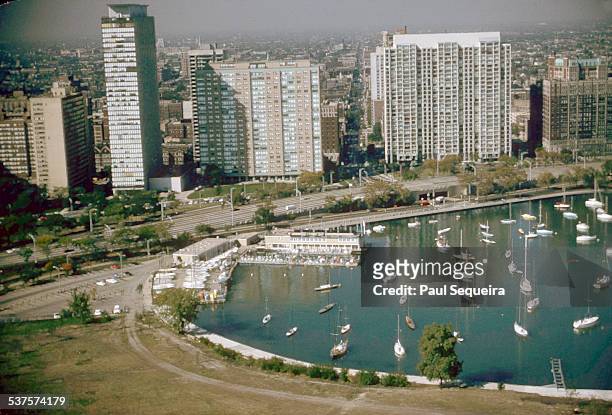 Aerial view showing the skyline along Lakeshore Drive with boats in Belmont Harbor, Chicago, Illinois, 1980s.