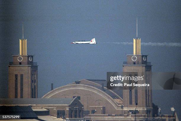 Jet flies above Navy Pier during the Chicago Air and Water Show, Chicago, Illinois, 1980s.