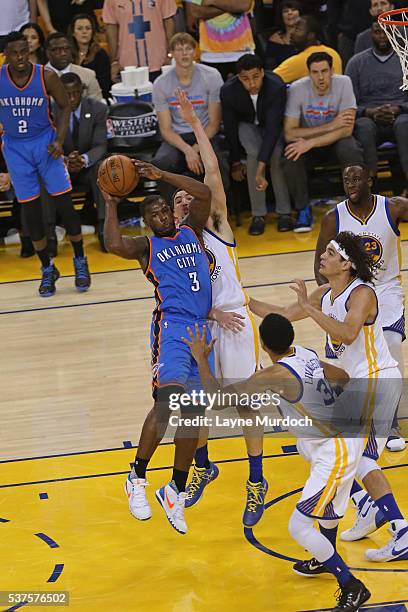 Dion Waiters of the Oklahoma City Thunder looks to pass the ball against the Golden State Warriors in Game Five of the Western Conference Finals...