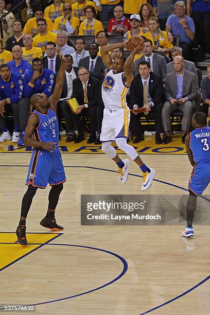 Andre Iguodala of the Golden State Warriors drives to the basket and passes the ball against the Oklahoma City Thunder in Game Five of the Western...
