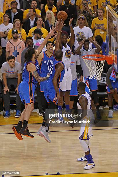 Harrison Barnes of the Golden State Warriors shoots the ball over players from the Oklahoma City Thunder in Game Five of the Western Conference...