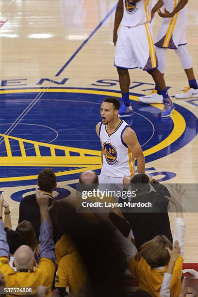 Stephen Curry of the Golden State Warriors yells to get the crowd into in Game Five of the Western Conference Finals against the Oklahoma City...