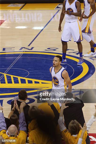 Stephen Curry of the Golden State Warriors yells to get the crowd into in Game Five of the Western Conference Finals against the Oklahoma City...