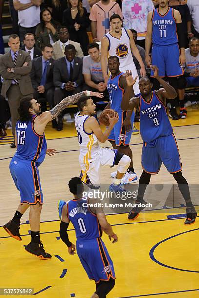 Stephen Curry of the Golden State Warriors drives to the basket against the Oklahoma City Thunder in Game Five of the Western Conference Finals...