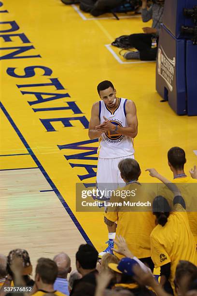 Stephen Curry of the Golden State Warriors claps to get the crowd into in Game Five of the Western Conference Finals against the Oklahoma City...